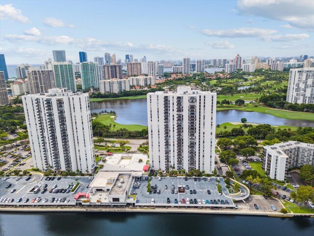 bird's eye view featuring a water view and a city view