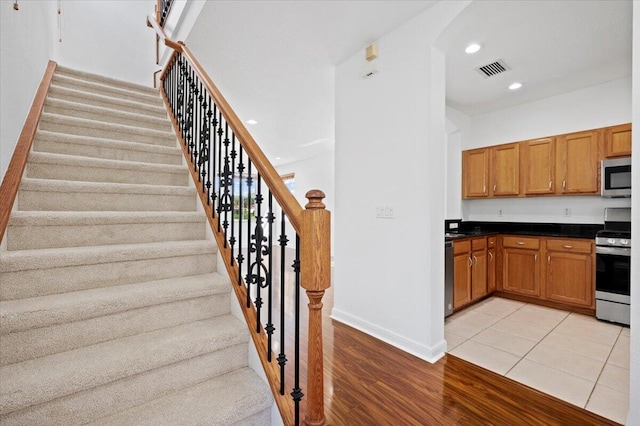 interior space featuring light wood-type flooring and stainless steel appliances