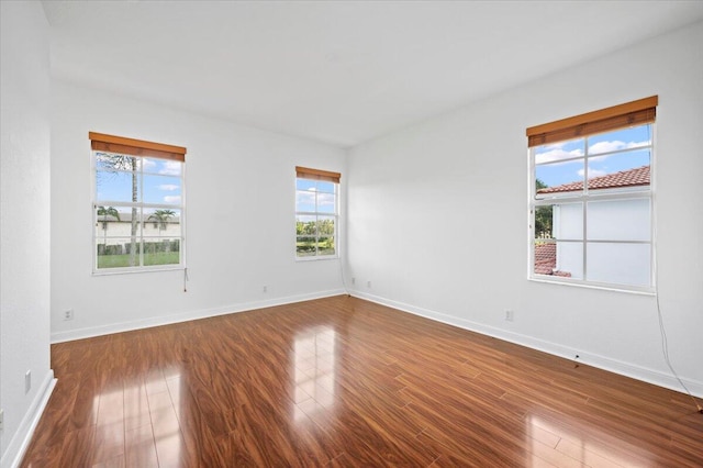 empty room with wood-type flooring