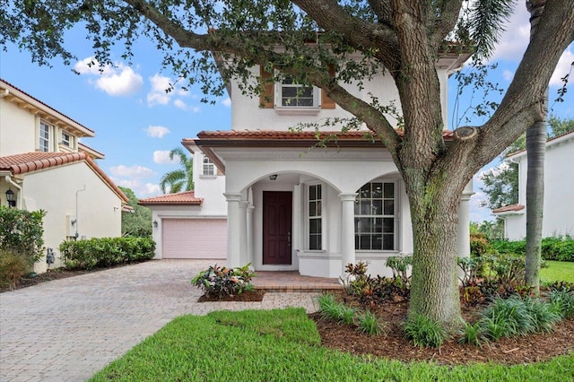 mediterranean / spanish-style house featuring a garage