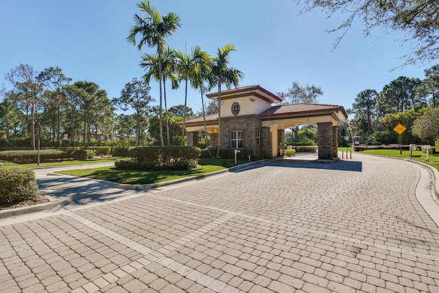 mediterranean / spanish-style house featuring a front lawn