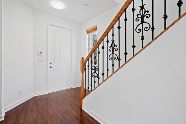 foyer with dark hardwood / wood-style flooring