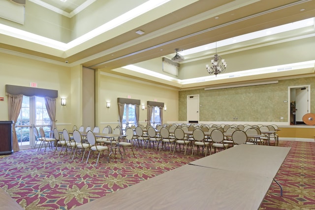 interior space with crown molding, a high ceiling, carpet floors, and a tray ceiling