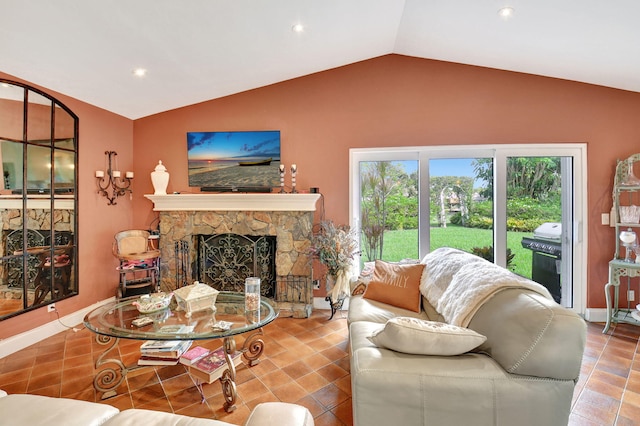 living room featuring lofted ceiling, tile patterned floors, and a stone fireplace