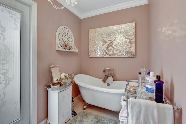 bathroom with tile patterned flooring, a bath, and crown molding