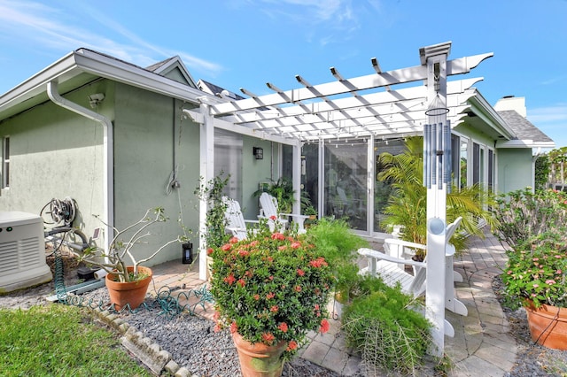 back of property with a pergola