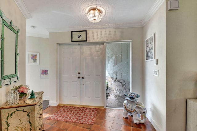 foyer with a chandelier, hardwood / wood-style floors, and ornamental molding