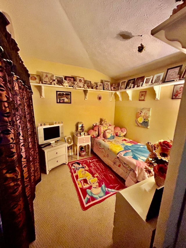 carpeted bedroom with lofted ceiling and a textured ceiling