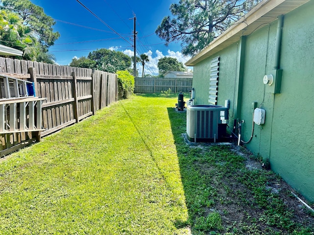 view of yard featuring central AC unit