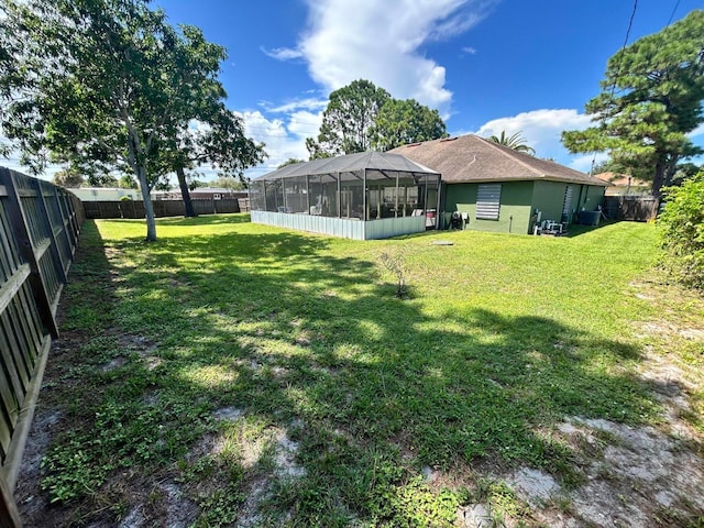 view of yard featuring a lanai