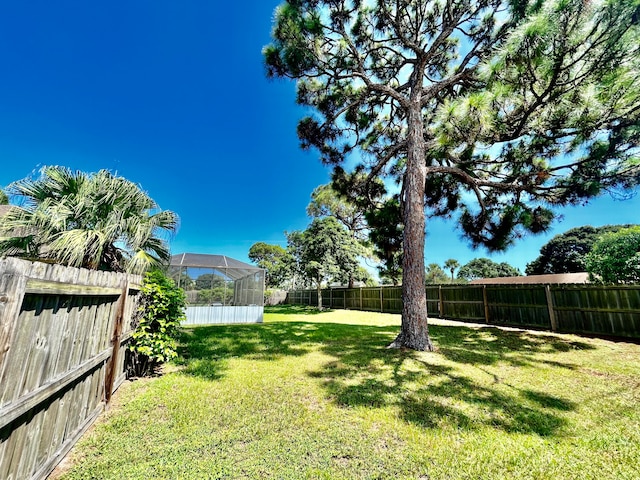 view of yard with a lanai