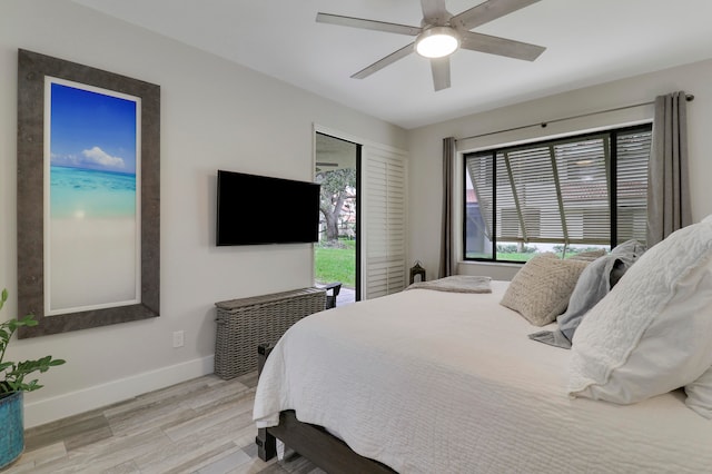 bedroom featuring light hardwood / wood-style flooring and ceiling fan