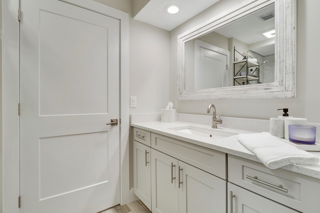 bathroom featuring vanity and hardwood / wood-style floors