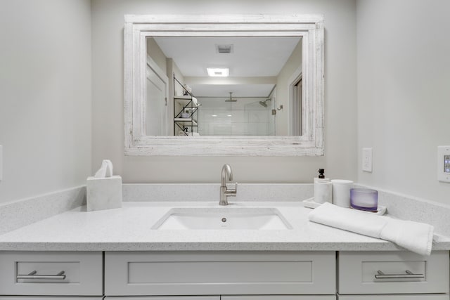 bathroom featuring vanity and walk in shower