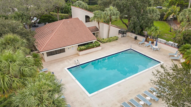 view of pool featuring a patio