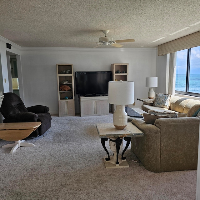 carpeted living room with a textured ceiling and ceiling fan