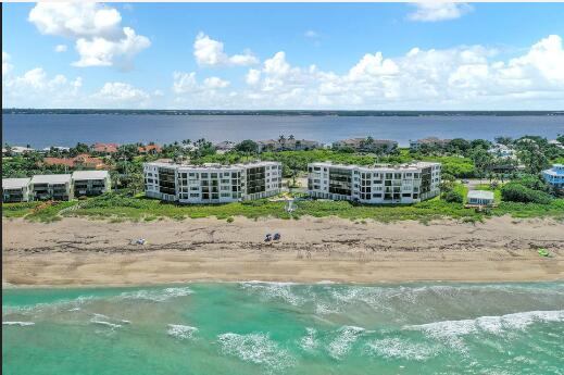 birds eye view of property featuring a view of the beach and a water view