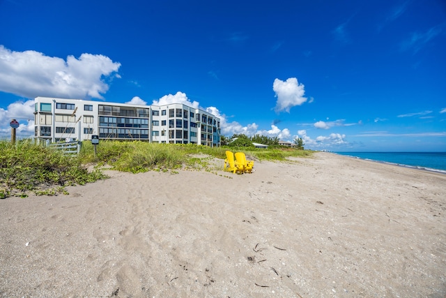 property view of water featuring a beach view