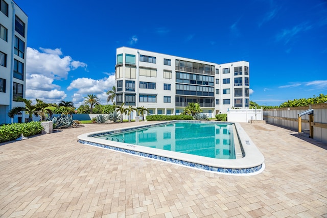 view of swimming pool with a patio area