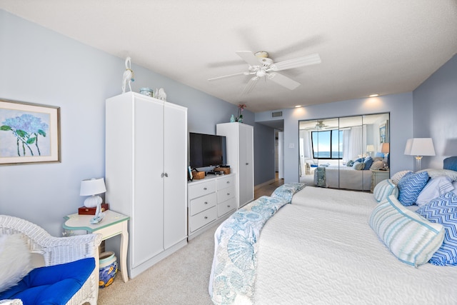 carpeted bedroom featuring ceiling fan