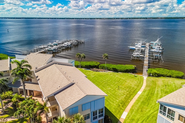 birds eye view of property with a water view