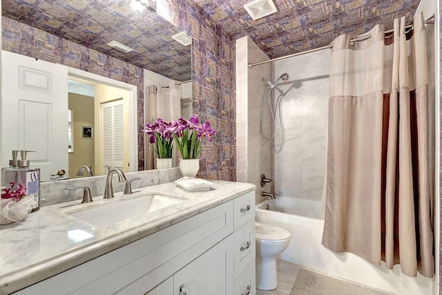 full bathroom with vanity, toilet, and shower / bathtub combination with curtain