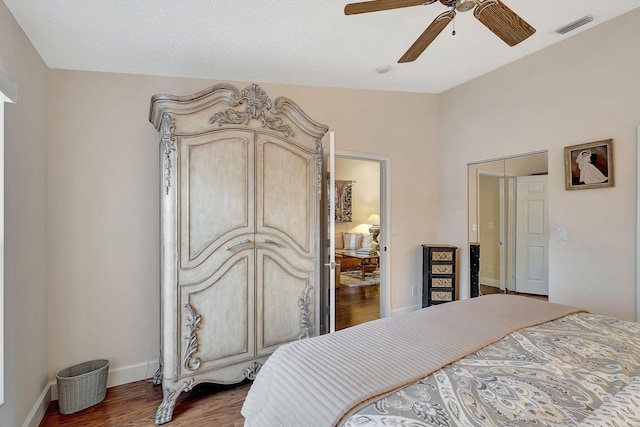 bedroom featuring dark wood-type flooring and ceiling fan