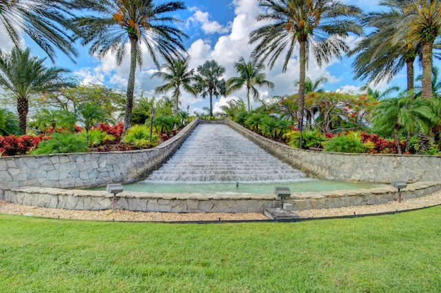 view of home's community with a lawn