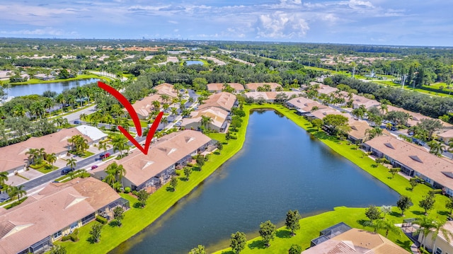 birds eye view of property featuring a water view