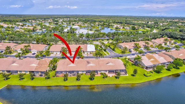 birds eye view of property featuring a water view