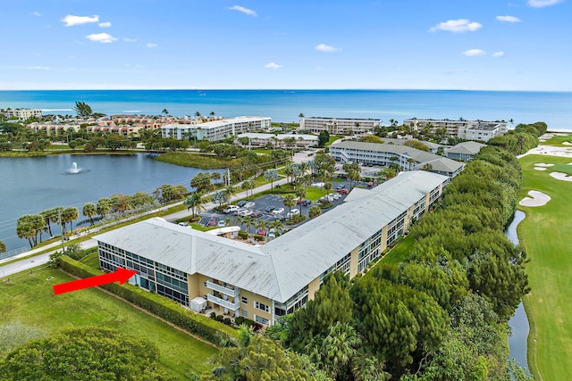 birds eye view of property featuring a water view