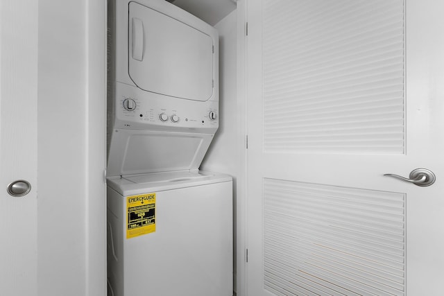 laundry room featuring stacked washer and dryer