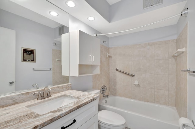 full bathroom with vanity, toilet, and tiled shower / bath