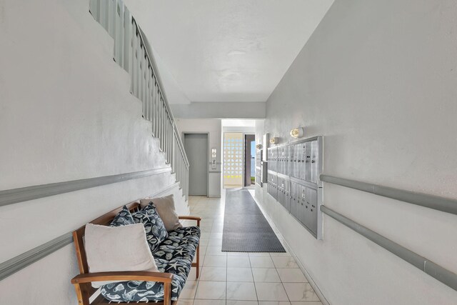 corridor with light tile patterned floors