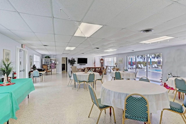 dining room featuring a paneled ceiling