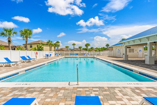 view of swimming pool with a patio