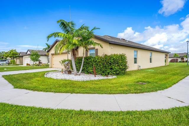 view of property exterior featuring a garage and a lawn