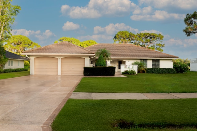 view of front facade with a garage and a front yard