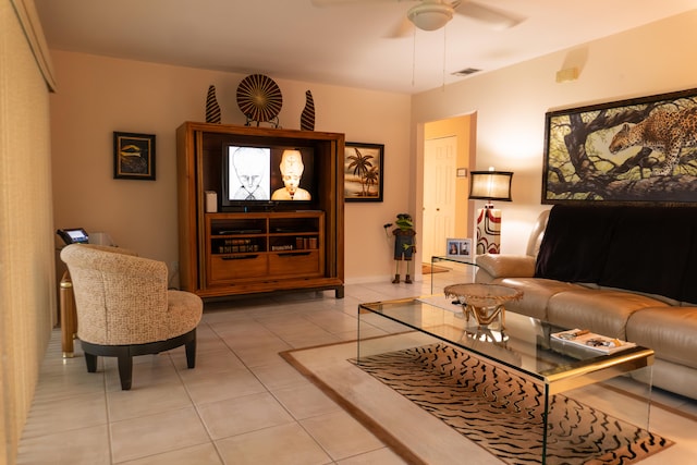 living room with ceiling fan and light tile patterned flooring