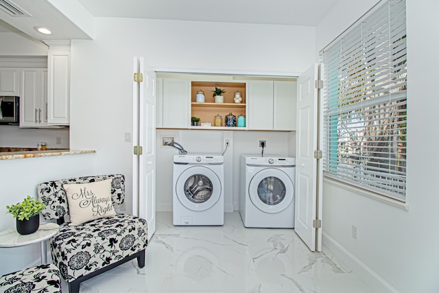 laundry area with separate washer and dryer