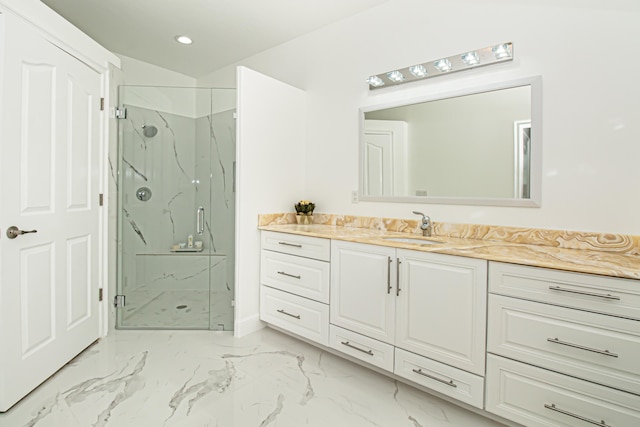 bathroom featuring vanity and an enclosed shower