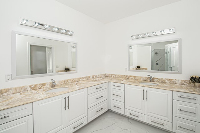 bathroom featuring vanity and a shower with shower door