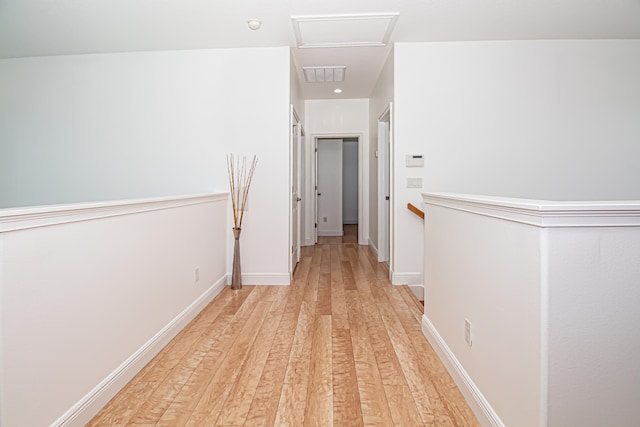 hall with light hardwood / wood-style floors