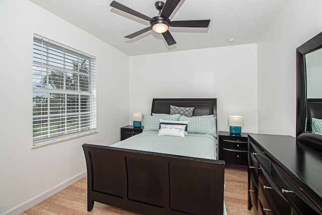 bedroom featuring light hardwood / wood-style flooring and ceiling fan