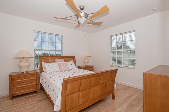 bedroom featuring light hardwood / wood-style flooring and ceiling fan