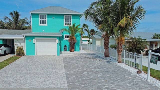 view of front of property with a garage