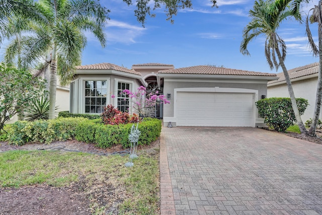 mediterranean / spanish-style house featuring a garage