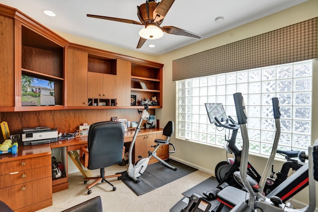 office space featuring ceiling fan and light tile patterned floors