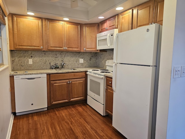 kitchen featuring ornamental molding, white appliances, dark hardwood / wood-style flooring, and tasteful backsplash