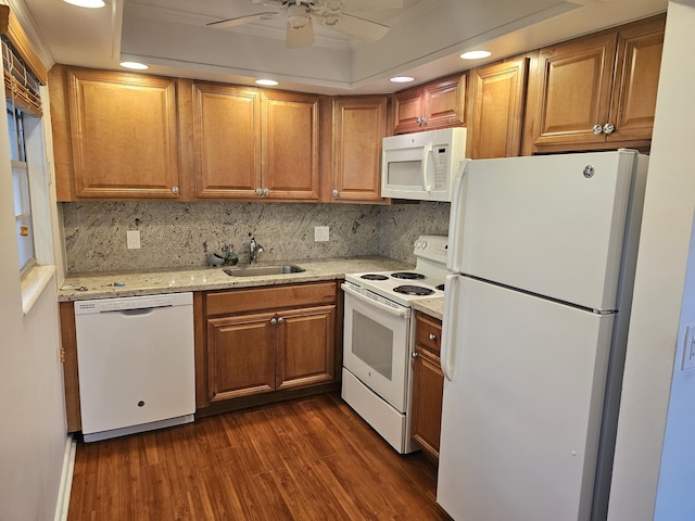 kitchen with white appliances, dark wood-type flooring, sink, decorative backsplash, and ceiling fan